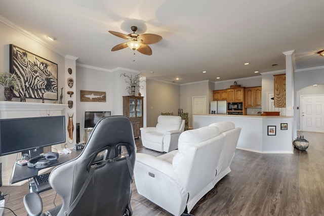 8614 Granville Dr, Dallas, TX 75249 - living room featuring a fireplace, a ceiling fan, wood finished floors, ornamental molding, and recessed lighting