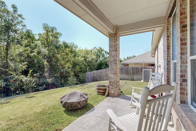 8614 Granville Dr, Dallas, TX 75249 - view of yard with central AC unit, a fire pit, and a patio