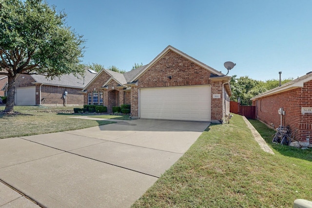 8614 Granville Dr, Dallas, TX 75249 - view of front of property with an attached garage, concrete driveway, and brick siding