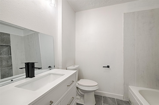 3229 Poteet Dr, Mesquite, TX 75150 - bathroom featuring vanity, a bathtub, toilet, tile patterned floors, and a textured ceiling