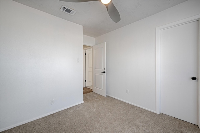 3229 Poteet Dr, Mesquite, TX 75150 - unfurnished bedroom featuring carpet floors and a ceiling fan
