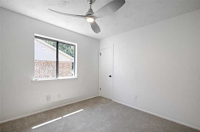 3229 Poteet Dr, Mesquite, TX 75150 - carpeted spare room featuring a ceiling fan and a textured ceiling