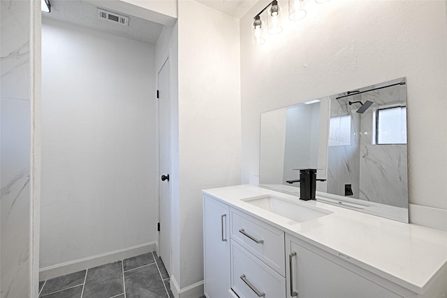 3229 Poteet Dr, Mesquite, TX 75150 - bathroom with vanity, a marble finish shower, and baseboards