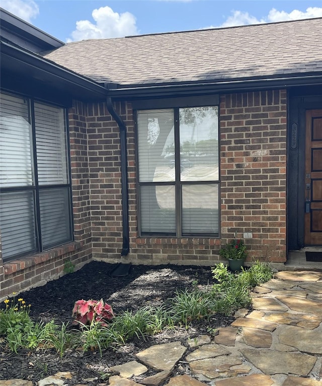 3229 Poteet Dr, Mesquite, TX 75150 - property entrance featuring brick siding and roof with shingles