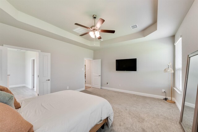 6005 Loving Ct, Midlothian, TX 76065 - bedroom with a raised ceiling, light colored carpet, and baseboards
