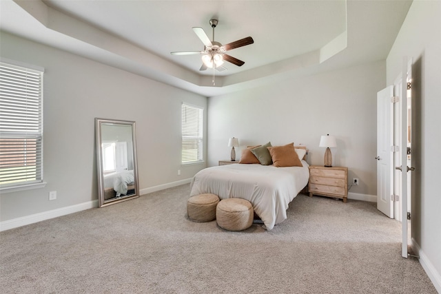 6005 Loving Ct, Midlothian, TX 76065 - bedroom with a raised ceiling, light carpet, baseboards, and ceiling fan