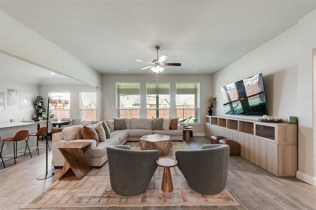 6005 Loving Ct, Midlothian, TX 76065 - living area with light wood-style floors, ceiling fan, and baseboards
