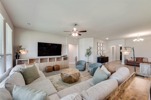6005 Loving Ct, Midlothian, TX 76065 - living area with a chandelier, a ceiling fan, and baseboards