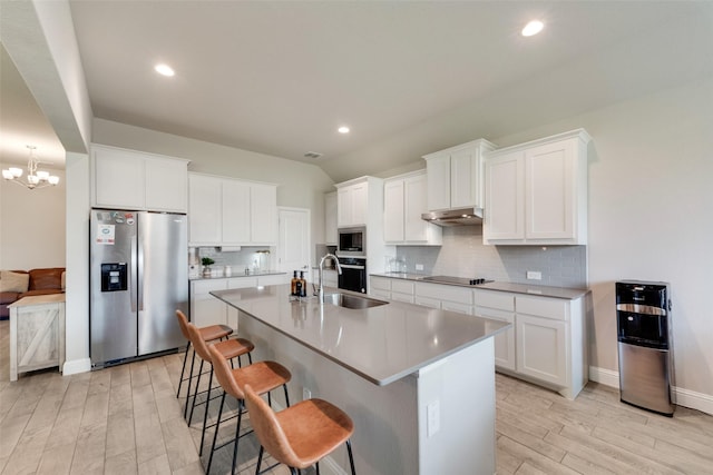 6005 Loving Ct, Midlothian, TX 76065 - kitchen with stainless steel appliances, a sink, light wood finished floors, backsplash, and recessed lighting
