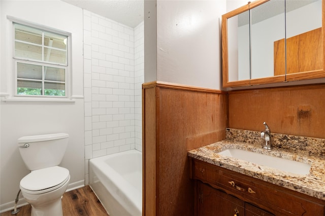 1019 E Elm St, Hillsboro, TX 76645 - bathroom with wood finished floors, toilet, and vanity
