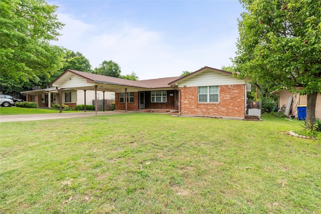 1019 E Elm St, Hillsboro, TX 76645 - ranch-style house featuring brick siding, driveway, a carport, and a front yard