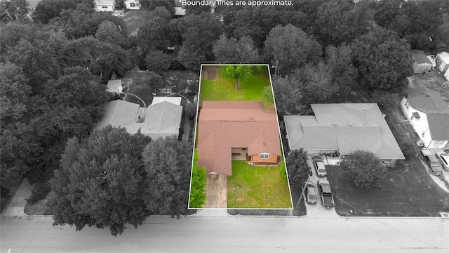 1019 E Elm St, Hillsboro, TX 76645 - aerial perspective of suburban area with property parcel outlined and a forest