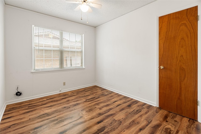 1019 E Elm St, Hillsboro, TX 76645 - empty room featuring a textured ceiling, a ceiling fan, wood finished floors, and baseboards