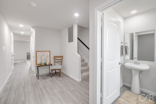 409 Garvin St, Eastland, TX 76448 - corridor featuring wood finished floors, recessed lighting, baseboards, and stairs