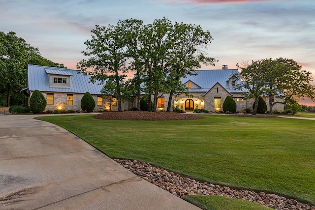 1100 Triple Crown Ct, Bartonville, TX 76226 - view of front of house with stone siding, a standing seam roof, a lawn, and metal roof