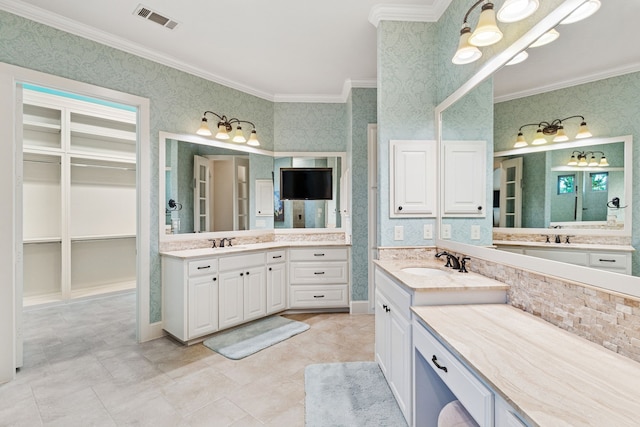 1100 Triple Crown Ct, Bartonville, TX 76226 - bathroom featuring ornamental molding, wallpapered walls, two vanities, and a spacious closet