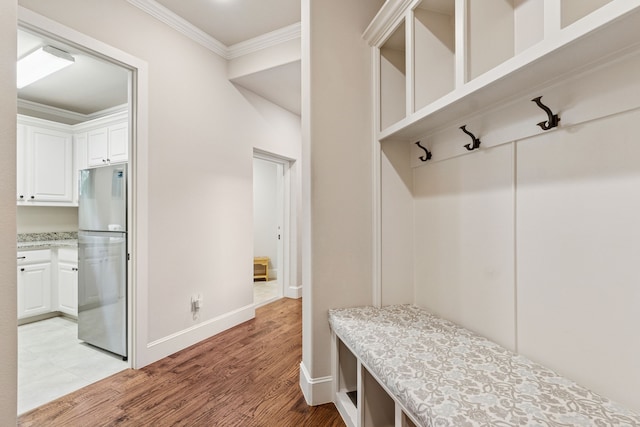 1100 Triple Crown Ct, Bartonville, TX 76226 - mudroom featuring crown molding, light wood-type flooring, and baseboards