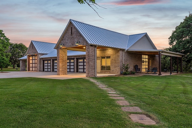 1100 Triple Crown Ct, Bartonville, TX 76226 - back of house featuring a standing seam roof, concrete driveway, a lawn, and brick siding