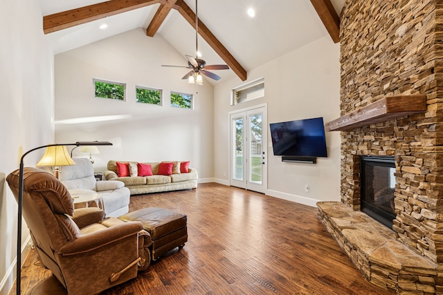 1100 Triple Crown Ct, Bartonville, TX 76226 - living area featuring beam ceiling, high vaulted ceiling, wood finished floors, ceiling fan, and a stone fireplace