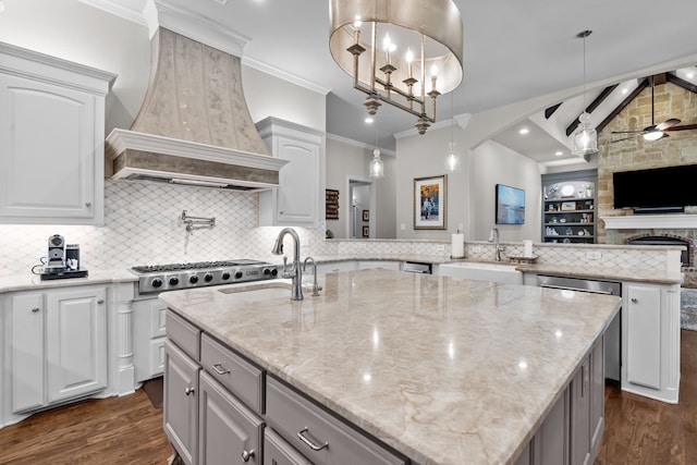 1809 Summit Ct, Keller, TX 76262 - kitchen with premium range hood, a sink, a peninsula, a center island with sink, and ornamental molding