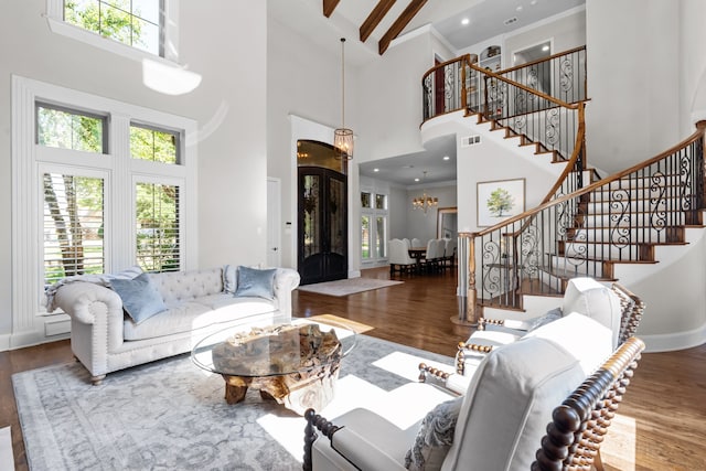 1809 Summit Ct, Keller, TX 76262 - living area with high vaulted ceiling, wood finished floors, stairs, a chandelier, and baseboards