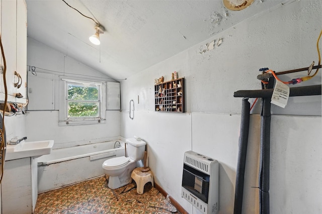 402 S Watson St, Alvarado, TX 76009 - full bathroom with heating unit, lofted ceiling, a tub to relax in, toilet, and tile patterned floors