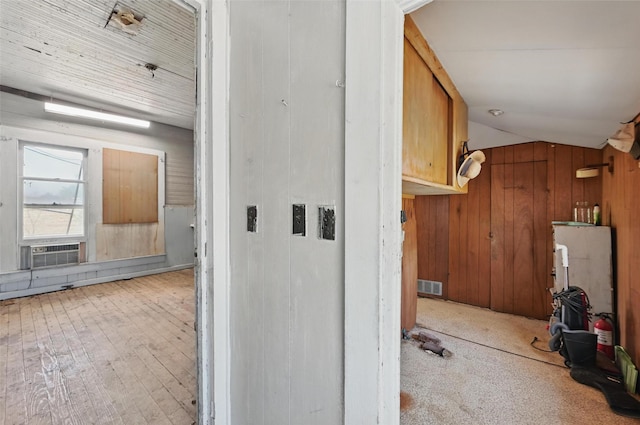 402 S Watson St, Alvarado, TX 76009 - hall featuring wooden walls, cooling unit, and hardwood / wood-style floors