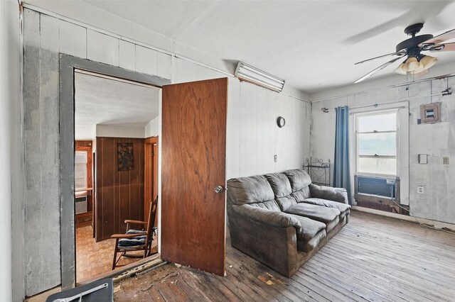 402 S Watson St, Alvarado, TX 76009 - living room featuring ceiling fan, wood finished floors, and cooling unit