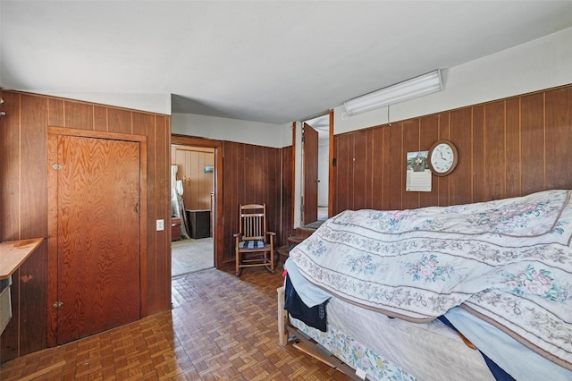 402 S Watson St, Alvarado, TX 76009 - bedroom featuring wood walls