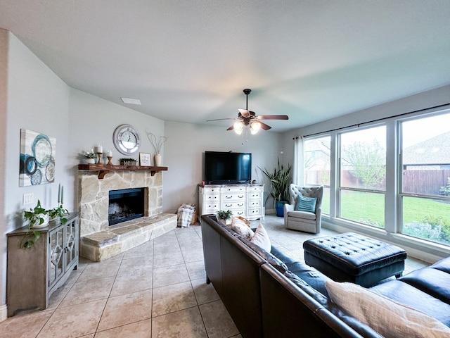 4237 Old Timber Ln, Fort Worth, TX 76036 - living area featuring a ceiling fan, light tile patterned flooring, and a stone fireplace