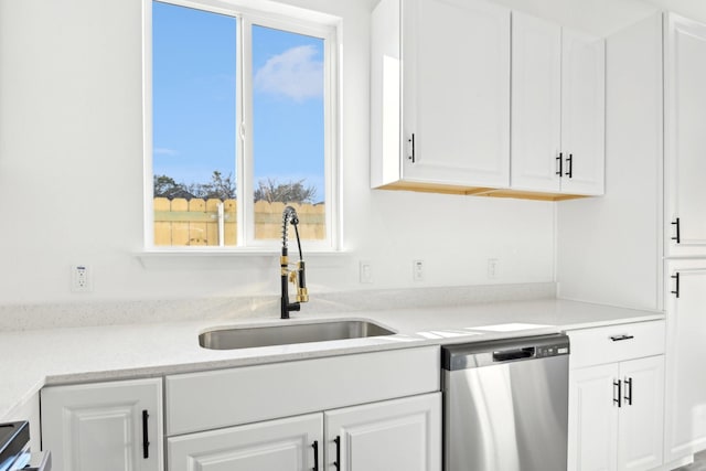 3613 Durango Trl, Granbury, TX 76048 - kitchen featuring dishwasher, a sink, white cabinetry, and light countertops