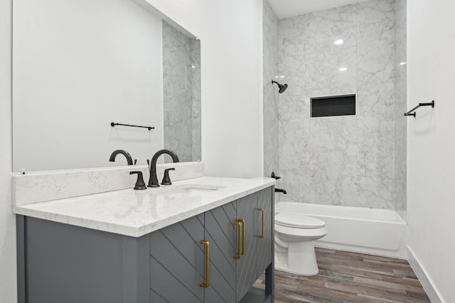 3613 Durango Trl, Granbury, TX 76048 - bathroom with wood finished floors, toilet, vanity, and  shower combination