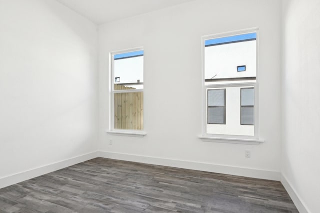3613 Durango Trl, Granbury, TX 76048 - unfurnished room featuring dark wood-style floors, healthy amount of natural light, and baseboards