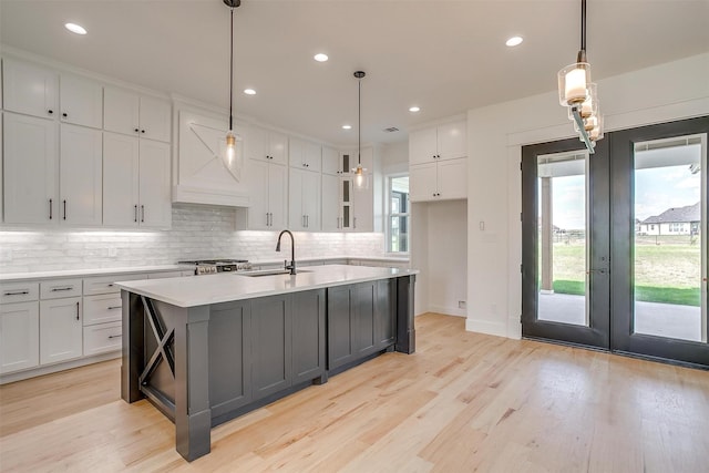138 Buddy Ct, Millsap, TX 76066 - kitchen featuring a sink, healthy amount of natural light, white cabinets, tasteful backsplash, and recessed lighting