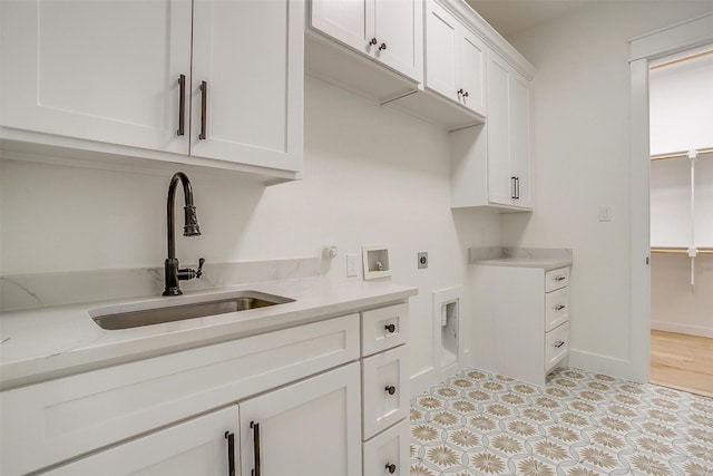 138 Buddy Ct, Millsap, TX 76066 - washroom featuring hookup for an electric dryer, cabinet space, washer hookup, and baseboards