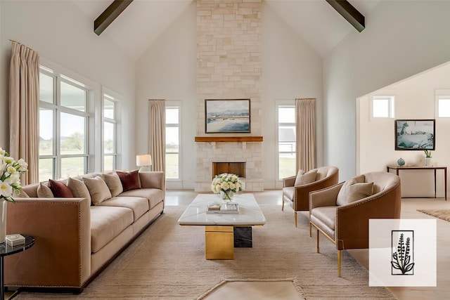 138 Buddy Ct, Millsap, TX 76066 - living area featuring high vaulted ceiling, a stone fireplace, and beam ceiling