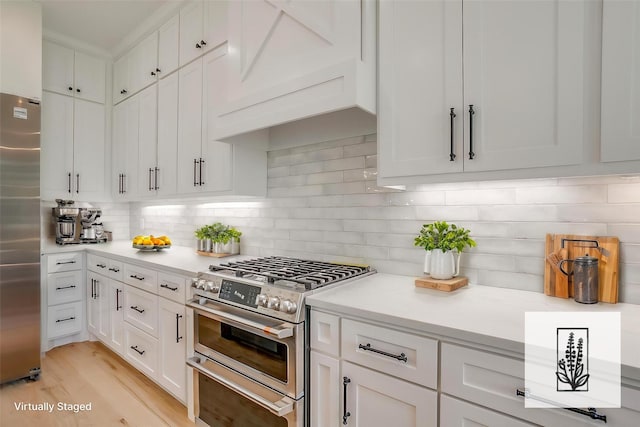 138 Buddy Ct, Millsap, TX 76066 - kitchen featuring appliances with stainless steel finishes, white cabinets, light countertops, and decorative backsplash