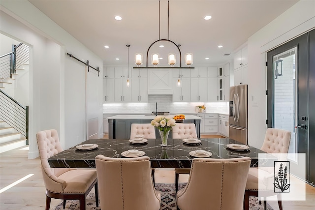 138 Buddy Ct, Millsap, TX 76066 - dining area with a barn door, stairway, and recessed lighting