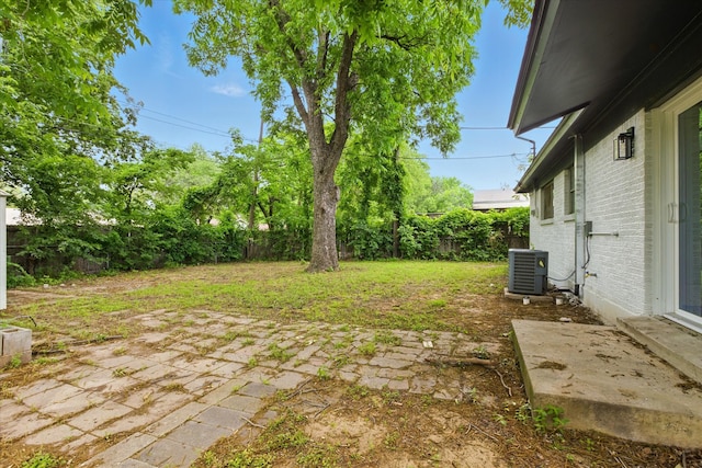 4709 Shady Hill Dr, Forest Hill, TX 76119 - view of yard featuring a patio and central AC