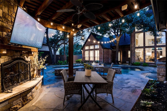 6616 Shoal Forest Ct, Plano, TX 75024 - view of patio with an outdoor stone fireplace, fence, a ceiling fan, an outdoor kitchen, and outdoor dining space