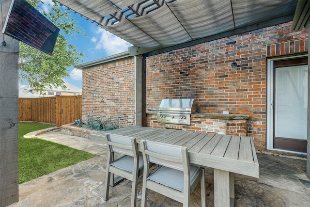5060 Loma Alta Dr, Frisco, TX 75034 - view of patio with grilling area, area for grilling, outdoor dining area, and fence