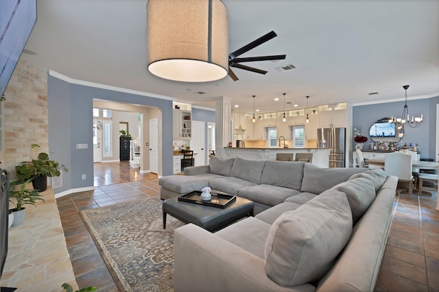 1123 Shadetree Ln, Allen, TX 75013 - living room featuring crown molding, ceiling fan, plenty of natural light, a chandelier, and baseboards