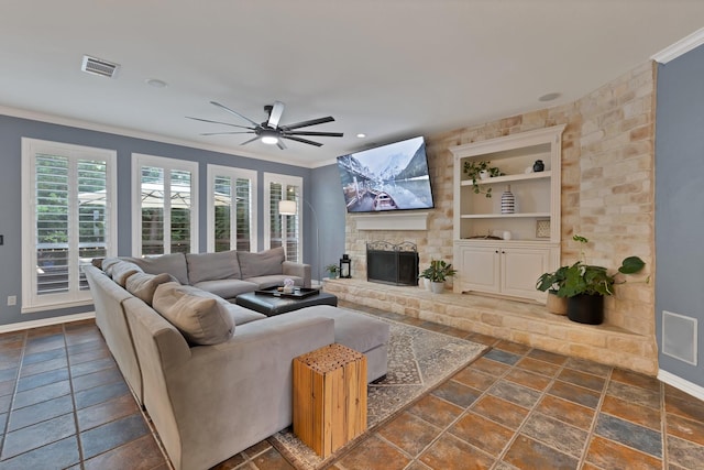 1123 Shadetree Ln, Allen, TX 75013 - living room featuring ornamental molding, baseboards, built in features, a fireplace with raised hearth, and a ceiling fan