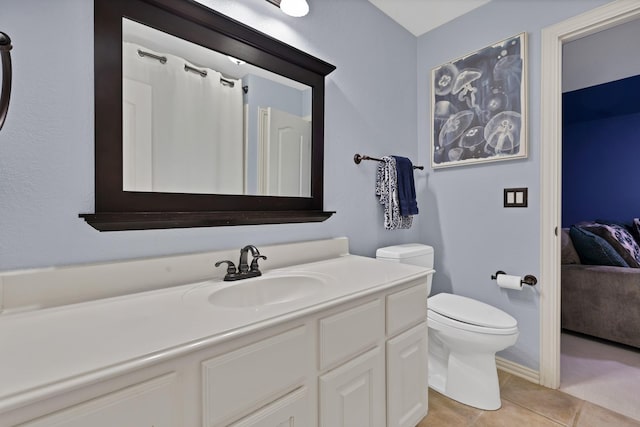 1123 Shadetree Ln, Allen, TX 75013 - ensuite bathroom featuring vanity, tile patterned flooring, and toilet