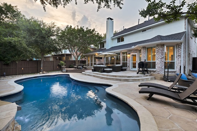 1123 Shadetree Ln, Allen, TX 75013 - pool at dusk featuring a patio