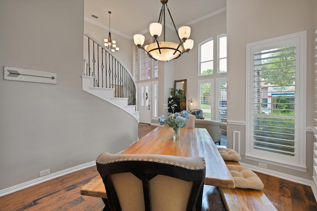 1123 Shadetree Ln, Allen, TX 75013 - dining space with a chandelier, ornamental molding, stairway, baseboards, and dark wood-type flooring