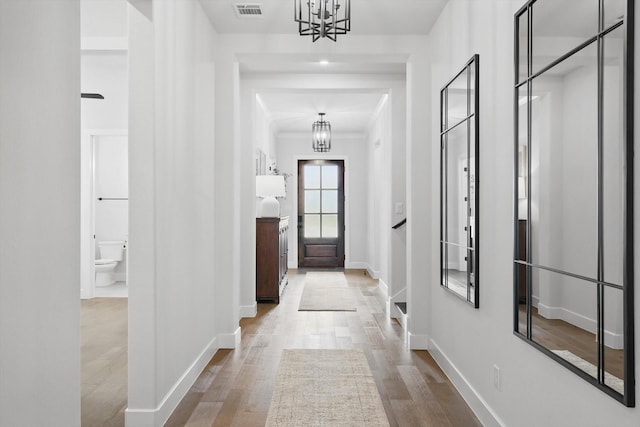 330 Peach Point Rd, Prosper, TX 75078 - corridor with a chandelier, baseboards, and wood finished floors