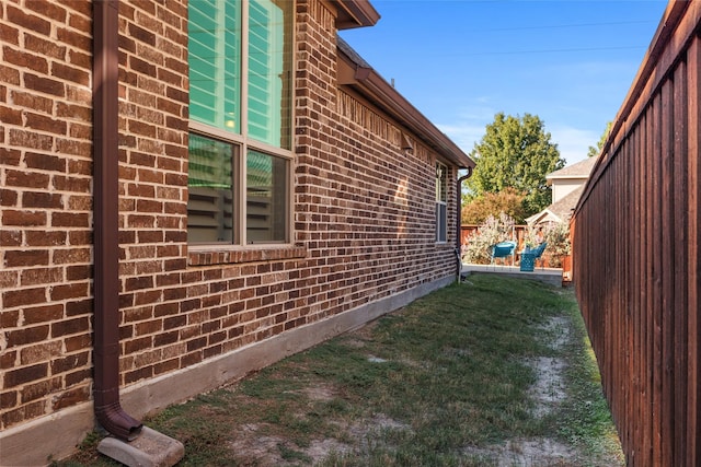 864 Gaited Trl, Frisco, TX 75036 - view of home's exterior with brick siding and a lawn