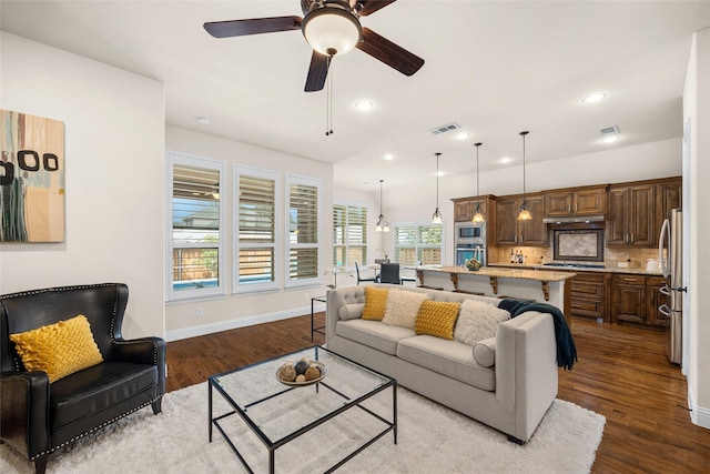 864 Gaited Trl, Frisco, TX 75036 - living room featuring dark wood-style flooring, baseboards, a ceiling fan, and recessed lighting