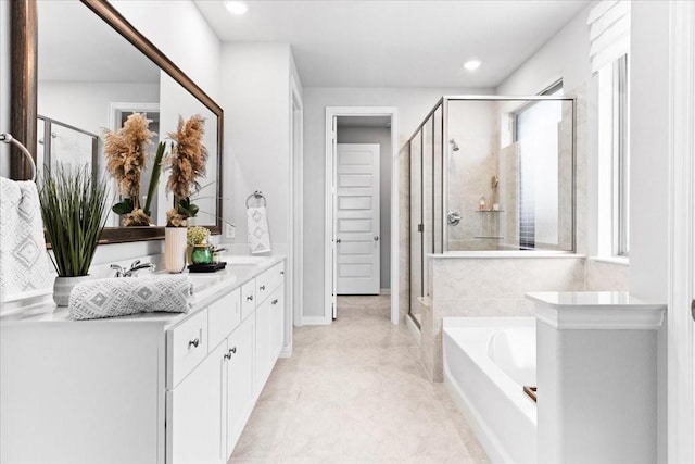 4342 Hudson St, Fate, TX 75087 - bathroom with double vanity, a garden tub, a shower stall, recessed lighting, and tile patterned flooring